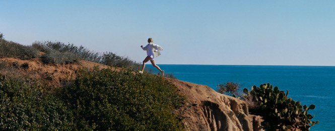 Woman Running on a Mountain